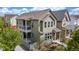 Captivating exterior elevation displaying a home with a balcony, manicured landscaping, and a welcoming entrance at 1754 W 66Th Ave, Denver, CO 80221