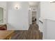 Bright hallway with modern lighting leading to a bedroom at 1754 W 66Th Ave, Denver, CO 80221