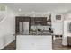 Modern kitchen island featuring sleek countertops, stainless steel appliances, and stylish cabinetry at 1754 W 66Th Ave, Denver, CO 80221