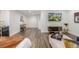 Spacious living room with vinyl floors, entertainment center, and modern décor at 1754 W 66Th Ave, Denver, CO 80221