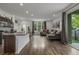 Bright and open living area with sleek modern kitchen and comfortable seating arrangement at 1754 W 66Th Ave, Denver, CO 80221