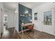 Bright office space with modern desk, shelving, and a door to the outside at 1754 W 66Th Ave, Denver, CO 80221