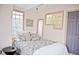 Cozy bedroom featuring ample natural light, glass block windows, and a comfortable bed for relaxation at 826 Maxwell Ave, Boulder, CO 80304