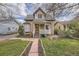 Charming home featuring a cozy front porch, landscaped yard and eye-catching stonework walkway at 826 Maxwell Ave, Boulder, CO 80304