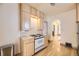 Well-lit kitchen with a classic white range oven, wooden cabinets, and bright countertops and hardwood floors at 826 Maxwell Ave, Boulder, CO 80304