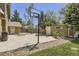 Backyard featuring a basketball court, storage shed, and grassy area, perfect for outdoor activities at 1973 S Pitkin St, Aurora, CO 80013