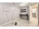 Finished basement area with desk, floating shelves and laminate floors at 1973 S Pitkin St, Aurora, CO 80013