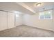 Unfurnished basement featuring carpeting, closet, and a window for natural light at 1973 S Pitkin St, Aurora, CO 80013