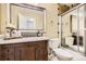 Bathroom features decorative vanity, framed mirror, and separate shower stall at 1973 S Pitkin St, Aurora, CO 80013