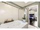 Luxurious bathroom with tiled walls, jacuzzi tub, and glass-enclosed shower at 1973 S Pitkin St, Aurora, CO 80013
