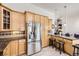 Bright kitchen featuring stainless steel appliances, granite countertops and wood cabinetry at 1973 S Pitkin St, Aurora, CO 80013