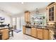 Bright kitchen featuring stainless steel appliances, granite countertops and wood cabinetry at 1973 S Pitkin St, Aurora, CO 80013