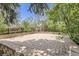 Brick paver patio surrounded by mature trees and lush greenery, a tranquil outdoor retreat at 1973 S Pitkin St, Aurora, CO 80013