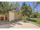 Backyard shed with neutral siding, gravel base, and convenient access, great for storage at 1973 S Pitkin St, Aurora, CO 80013