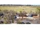 An aerial view of the home and surrounding neighborhood featuring a green field nearby at 14823 E Colgate Dr, Aurora, CO 80014