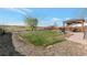 Large backyard featuring a grassy lawn, a wooden fence, a gazebo, and a grill area at 14823 E Colgate Dr, Aurora, CO 80014