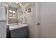Modern bathroom with a gray vanity, a large mirror, and stylish fixtures at 14823 E Colgate Dr, Aurora, CO 80014
