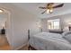 Bright main bedroom with light walls and a classic bed frame with hardwood floors at 14823 E Colgate Dr, Aurora, CO 80014