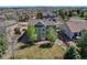 Aerial view of home showcasing lush backyard and the surrounding neighborhood at 22021 Pebble Brook Ln, Parker, CO 80138