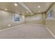 Unfinished basement with carpet, neutral paint, and recessed lighting offers a clean, blank canvas at 22021 Pebble Brook Ln, Parker, CO 80138