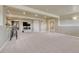 Finished basement with carpet, a wet bar, and additional room for exercise equipment at 22021 Pebble Brook Ln, Parker, CO 80138