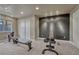 Basement workout area featuring carpeted floors, mirrored accent wall, and available workout equipment at 22021 Pebble Brook Ln, Parker, CO 80138