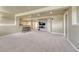 Spacious finished basement with neutral carpet, wet bar, and media area at 22021 Pebble Brook Ln, Parker, CO 80138