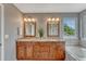 Contemporary bathroom featuring double sinks and a large vanity at 22021 Pebble Brook Ln, Parker, CO 80138