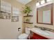 Cozy bathroom with decorative shelves, granite countertop, and stylish mirror at 22021 Pebble Brook Ln, Parker, CO 80138