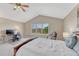 Comfortable bedroom with office setup, vaulted ceilings, and soft lighting at 22021 Pebble Brook Ln, Parker, CO 80138