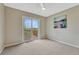 Bedroom includes carpet, ceiling fan, and sliding glass door to private deck with views at 22021 Pebble Brook Ln, Parker, CO 80138