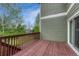 Cozy deck featuring wood railings and views of the nearby trees at 22021 Pebble Brook Ln, Parker, CO 80138