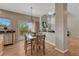 Cozy dining area with backyard access and views of the living room fireplace at 22021 Pebble Brook Ln, Parker, CO 80138