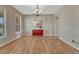 Empty dining room featuring hardwood floors, a modern chandelier, and neutral walls at 22021 Pebble Brook Ln, Parker, CO 80138