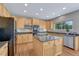 Bright and spacious kitchen with an island cooktop, stainless appliances, and ample cabinets at 22021 Pebble Brook Ln, Parker, CO 80138