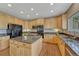 Modern kitchen with island, stainless appliances, and granite countertops at 22021 Pebble Brook Ln, Parker, CO 80138