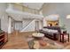 Open-concept living space with high ceilings and staircase leading to the upper level at 22021 Pebble Brook Ln, Parker, CO 80138