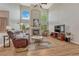 Bright living room featuring a fireplace, entertainment center, and plush seating at 22021 Pebble Brook Ln, Parker, CO 80138