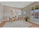 Cozy sitting room with hardwood floors, shuttered windows, neutral paint, and stylish furniture at 22021 Pebble Brook Ln, Parker, CO 80138
