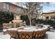 Inviting backyard with an outdoor fireplace and comfortable seating, perfect for entertaining at 100 S University Blvd # 11, Denver, CO 80209