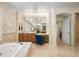 Spacious bathroom features a soaking tub, vanity area, and elegant tile work at 100 S University Blvd # 11, Denver, CO 80209