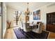 Formal dining room featuring a large window, chandelier, and plenty of space for entertaining at 100 S University Blvd # 11, Denver, CO 80209