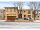 A stunning two-story home featuring a spacious garage and classic design elements and some snow at 100 S University Blvd # 11, Denver, CO 80209