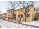 A stunning two-story home featuring a spacious garage and classic design elements and some snow at 100 S University Blvd # 11, Denver, CO 80209