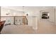 Upstairs landing with decorative railing and carpet, offering views of the downstairs living area at 100 S University Blvd # 11, Denver, CO 80209