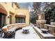 Charming patio with comfortable seating and an outdoor fireplace for cozy evenings at 100 S University Blvd # 11, Denver, CO 80209