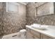 Stylish powder room features unique wallpaper, a modern sink, and elegant fixtures at 100 S University Blvd # 11, Denver, CO 80209