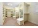 Large walk-in closet offers ample storage and organization, with multiple shelving units at 100 S University Blvd # 11, Denver, CO 80209