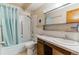 Bathroom features tile surround shower, vanity, and marble countertop at 635 S Alton Way # 12C, Denver, CO 80247