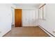 Bedroom featuring tan carpet with a closet and double window at 635 S Alton Way # 12C, Denver, CO 80247